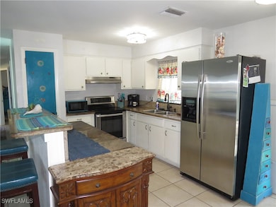 Kitchen featuring stainless steel appliances, visi