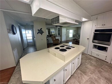 Kitchen featuring white cabinets, a healthy amount