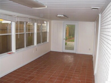Large 27' x 10' Enclosed Sunroom has tile floors w