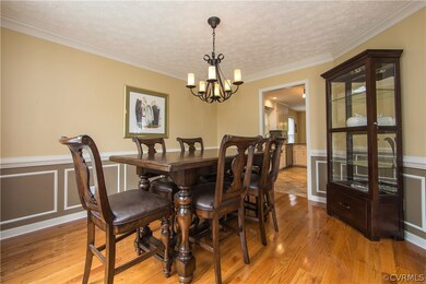 Formal dining with upgraded lighting, crown moldin