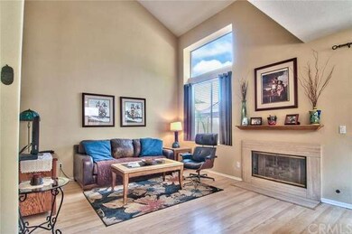 Living room. There are laminated wood floors in th