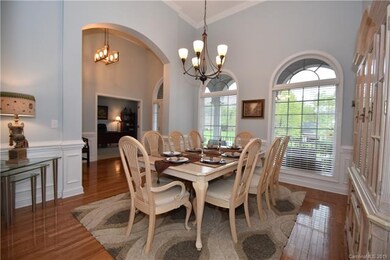 Gorgeous view of the Dining Room showing the arched doorways and windows and the relationship to the 2-story entryway!