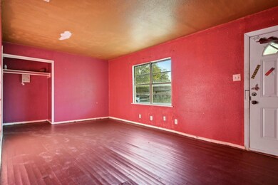 (View II) 21' x 17' Living Room:  Ample natural su