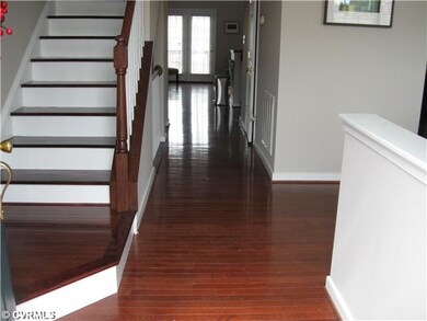Foyer - Inviting 20 ft. foyer with rich finished h