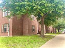 View of side of home featuring a lawn