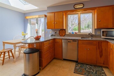 The eat-in kitchen with skylight,...