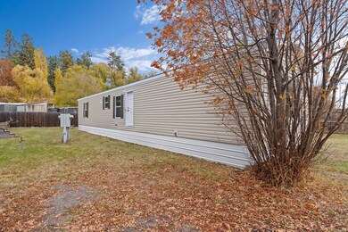 Kalahari Series Model 2663F-KH features crisp beige siding, brown shutters and white skirting