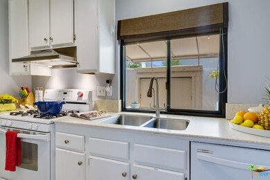 Kitchen overlooking enclosed patio