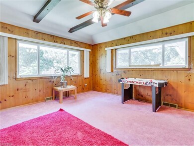 Family room off the dining room. Beamed ceiling, K
