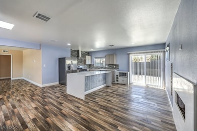 Kitchen featuring dark wood-style floors, visible