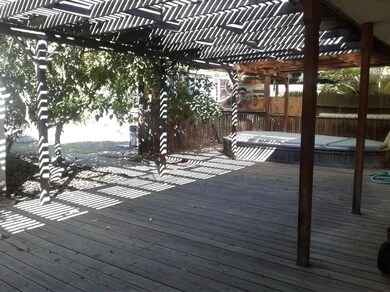 Wood deck with large spa.