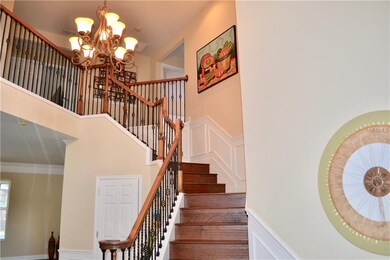Beautiful staircase with hardwood floors..