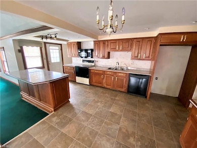 KITCHEN WITH VINYL FLOORING.