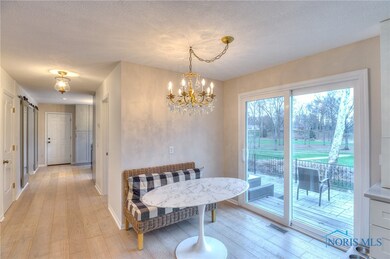 Remodeled eat-in kitchen with view of concrete pat