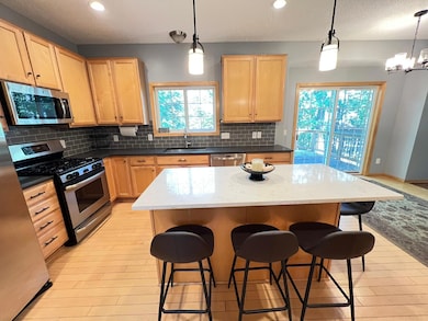 Tile backsplash and walkout to deck