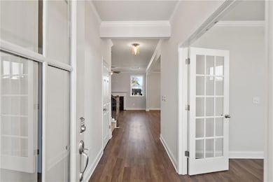 Hallway featuring dark hardwood / wood-style floor