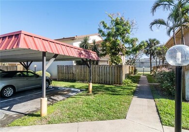 CARPORT FOR UNIT AND SIDEWALK TO UNIT