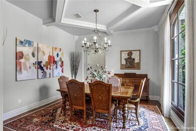 The foyer branches into a formal dining room crown