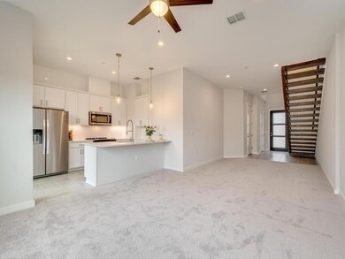Unfurnished living room with visible vents, ceili