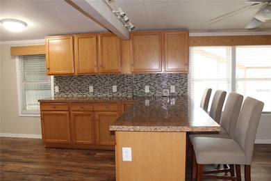 Additional soldid wood cabinets above eat at Bar between Kitchen and Dining room