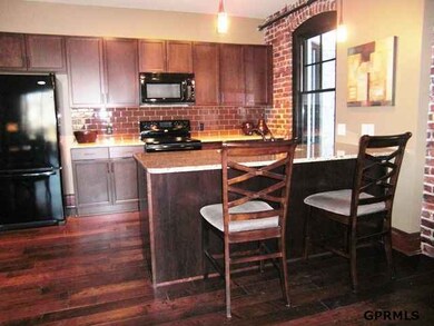 Brick walls, reclaimed wood floors, granite counters, stainless steel appliances, high quality windows.  Check out the video at www.nancyboe.cbshome.com