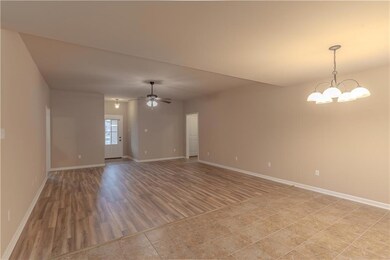 Living room looking from kitchen/dining area.