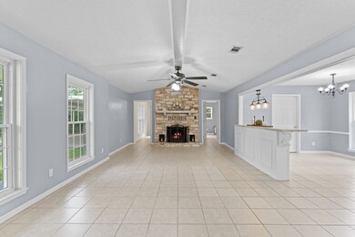 Family room features a beautiful wood burning bric