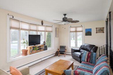 SUNKEN LIVING ROOM WITH LOTS OF NATURAL LIGHT.