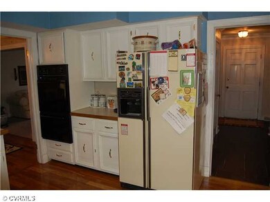 Kitchen - Kitchen: eat-in with hardwood floor, tiled countertops, double wall ovens, electric cook top, double drawer stainless steel dishwasher, work station area, white cabinets with crown molding and chair rail and pantry