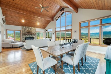Dining room with a fireplace, light wood-type floo