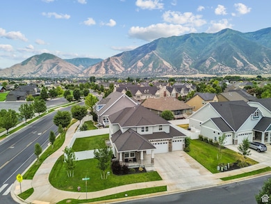Aerial perspective of suburban area featuring a mountain backdrop