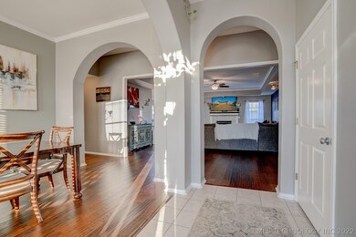 Entry view, arches open into a spacious formal din