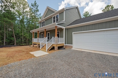 View of front of property with a porch, driveway, board and batten siding, and a shingled roof