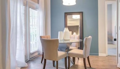 Dining space featuring baseboards, a healthy amoun
