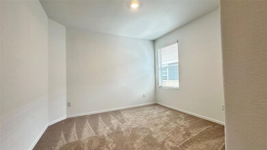 Spare room with carpet floors and baseboards