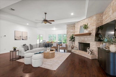 Living area with dark wood-style flooring, ceilin