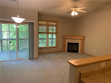 Living room with all new paint and carpeting. Beau