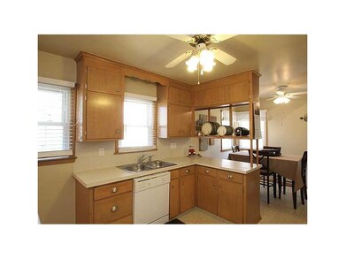 Kitchen. Newer hardware on cabinets, natural light