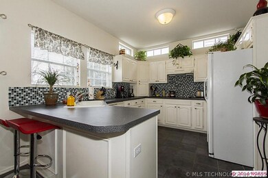 Pretty kitchen...newer mosaic tile backsplash lend