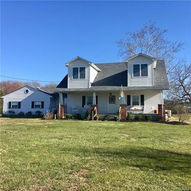 Front elevation of house with a deep porch.