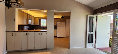 Kitchen entrance and living room.