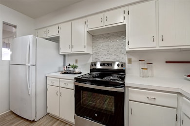 Freshly painted white kitchen cabinets.