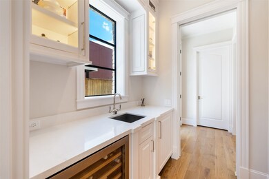 The butlers pantry has a chilled-wine/beverage fridge and plenty of additional storage for serving plates and other entertaining needs.