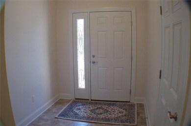 Spacious Entryway and door to 2 Car Garage