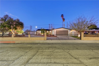 Single story home with driveway, a fenced front ya