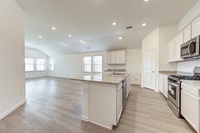 You'll love the OPEN concept floorplan with a kitchen open to the living room and offering an eat-in island
