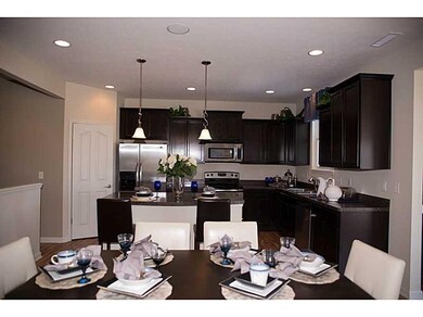 Kitchen. Photo is of a similar model & floor plan.