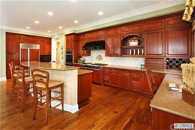 Gourmet kitchen opens to family room