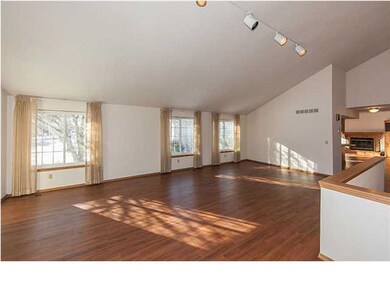 Living room with vaulted ceilings & lots of natura