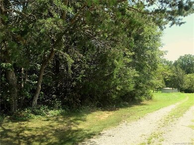 Side view looking down along the neighbors' drivew